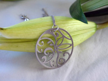 Floral Circle Pendant in stainless steel